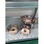 Three items of silver plate, a revolving breakfast dish and a pair of Victorian plated embossed