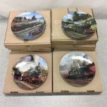 A collection of eight Davenport Pottery wall plates with railway scenes.