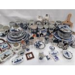 A large collection of Delft ware to include plates, bottles, tankards etc.