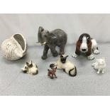 A collection of china animals, including Royal Doulton cats.