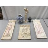 Three plaster wall plaques in the Greek style with a figurine and other items.