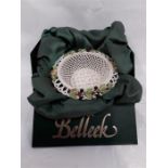 A boxed Belleek basket bowl.