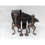 Brass items to include a coal scuttle, pair of fire dogs and a pair of candlesticks.