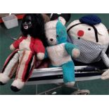 A children's pram together with teddies and porcelain dolls.