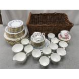 A quantity of Colclough china and a wicker basket.