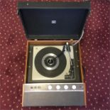 HMV Portable Record Player. This is model No. 2042 and comes with a fitted BSR Auto Changer
