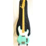 Electric Bass Guitar. Here we have a desert island green bass guitar which has only been used for