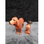 A Beswick Dachshund sitting up together with a large Redsetter.