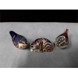 Crown Derby paperweights: Sleeping cat, gold stopper, Wren, bronzed stopper, Blue bird, silver