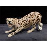 A Beswick study of a Cheetah. resting on front paws