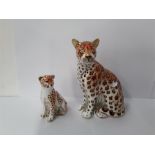 Crown Derby paperweight: Leopardess and Cheetah, gold stoppers, one box.