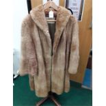 A vintage ladies brown fur coat.