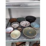 Eleven pieces of studio pottery by local artist c lock together with a amber glass bowl.