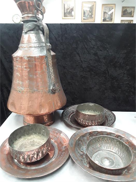 A quantity of copper Turkish market embossed bowls, pitcher etc.