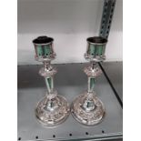 A pair of silver plated storm candlesticks.