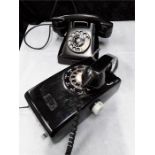 Two black telephones.