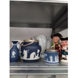 A Poole Pottery jug, three pieces of dark blue Wedgwood Jasperware, Beswick jug and two Toby jugs.