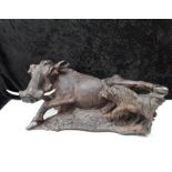 A late 19c Indian wooden study of a carved boar with its young