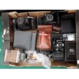 A box of various cameras to include mainly retractable.