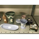 Nine pieces of Wedgwood Jasperware in different colours to include 8” green Jasper vase, lilac