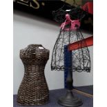 A metal ornate mannequin together with an ornate wicker mannequin.