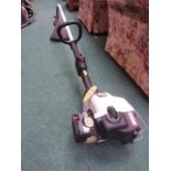 A Ryobi petrol strimmer.