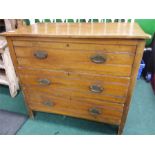 A chest of three drawers.