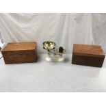 Two wooden boxes and a set of scales.