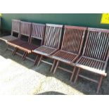 A harlequin set of garden chairs.