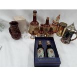 Various wade Bells Scotch Whisky decanters two empty together with two Bells glasses, water jug, a