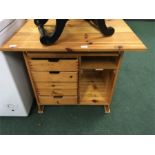 A small pine storage cabinet.