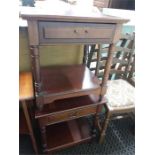 A pair of mahogany bedside tables.