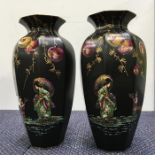 Two black vases depicting Geisha girls.
