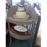 A corner washstand with bowl and jug together with two trays.