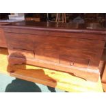 A teak storage box with two drawers.