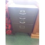 A metal filing cabinet.