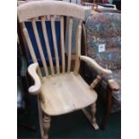 A pine railback rocking chair.