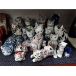 A collection of decorative cat ornaments.