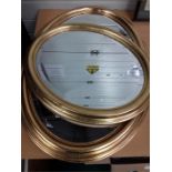 Two oval gilt framed mirrors