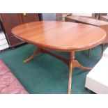 A large modern draw leaf dining table.