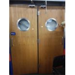 A pair of portholed fire doors 1.6w x 2.130h complete with door closers.