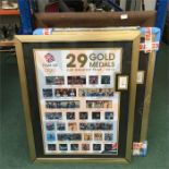 A large framed mirror with two posters celebrating Team GB at the 2012 Olympics.