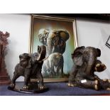 Two large African elephant ornaments together with a elephant picture.