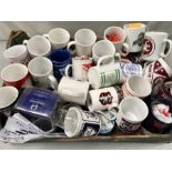 A box of football mugs, predominantly from the Scottish leagues.