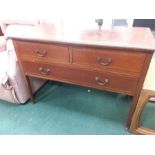 A mahogany three drawer dressing chest with banded inlay.