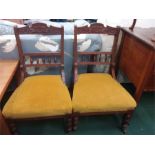 A pair of Edwardian mahogany chairs.