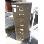 A four drawer filing cabinet.