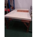 A large pine works table.