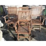 A set of four folding garden armchairs.