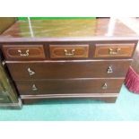 A mahogany chest of three drawers.